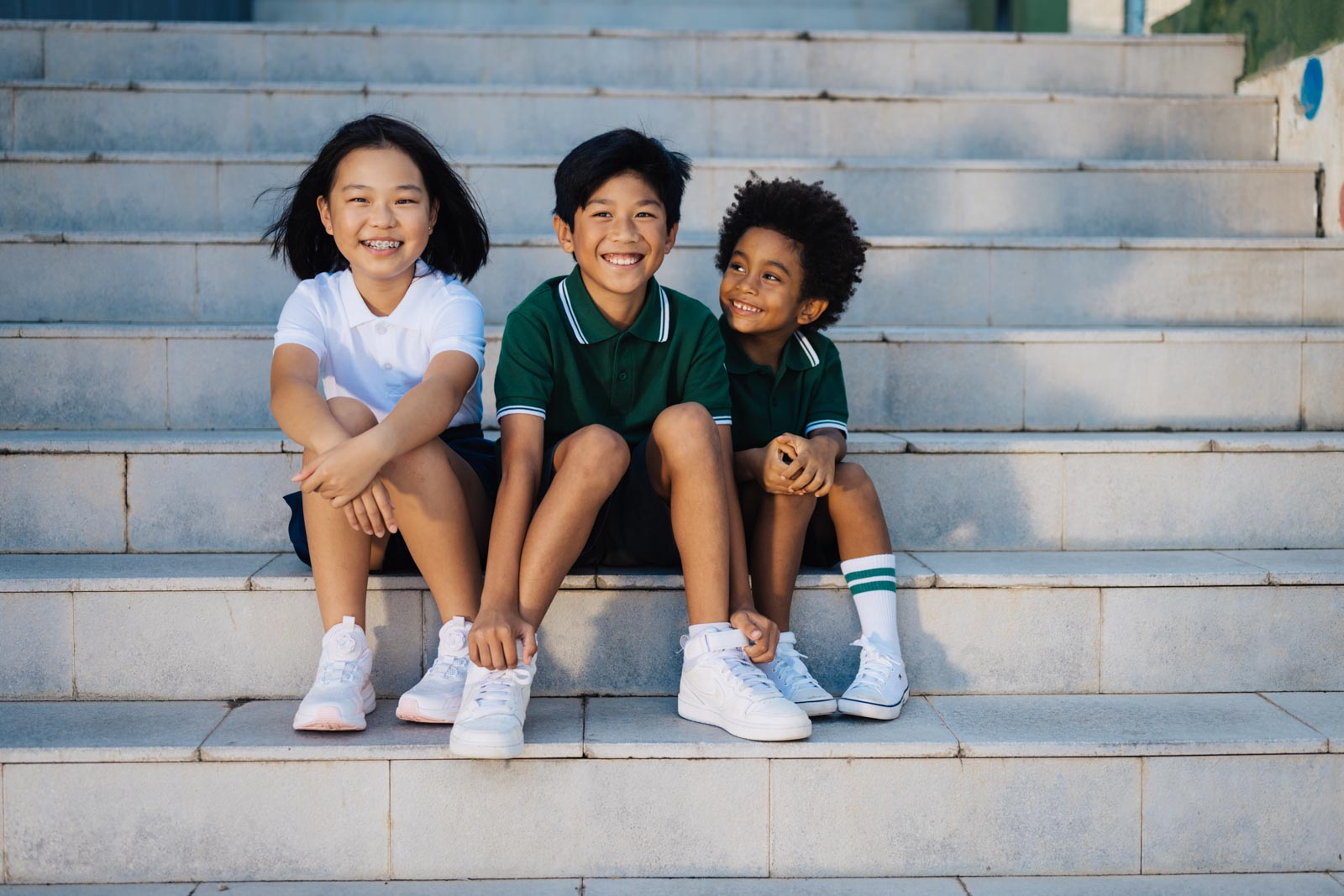 EAL children on some steps