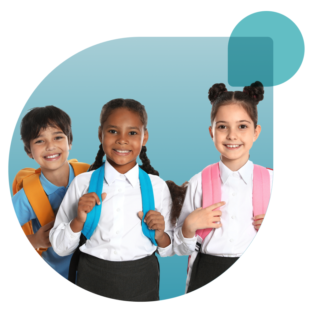 Three smiling diverse students wearing school backpacks in school uniform.