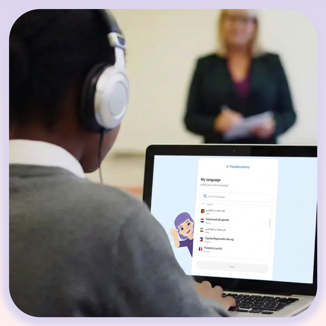 Teenage boy wearing headphones at a laptop using FlashAcademy®'s home language interface to complete his work.